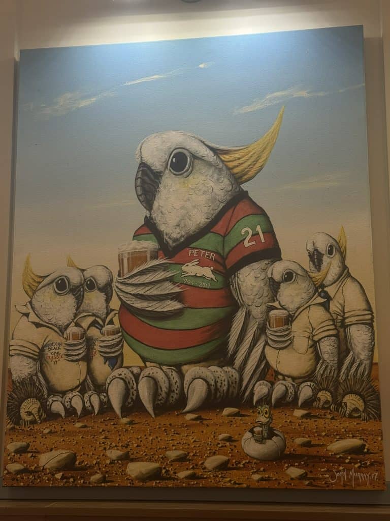 John Murray artwork featuring cockatoos wearing rugby league jerseys in the Lightning Ridge Bowling Club.